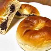 A plate of two Anpan, a traditional Japanese sweet bread filled with red bean paste